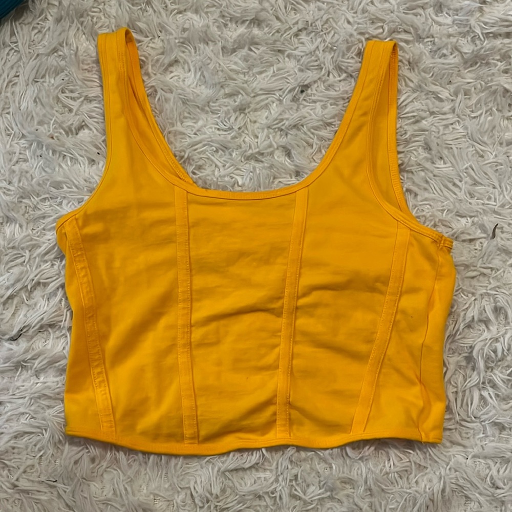 Bright orange tank top with detailing on front